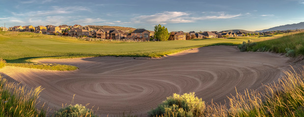 Panorama of a large sand trap on a golf course