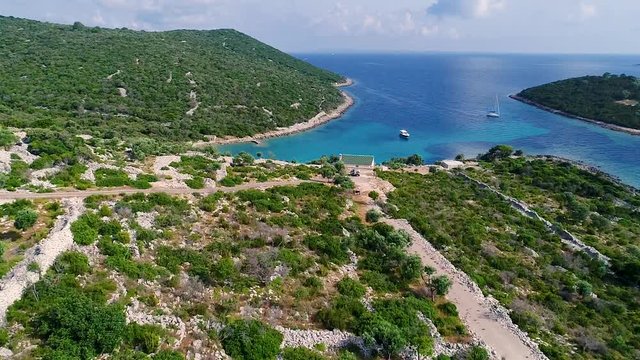 Aerial view of single speed boat floating over transparent water, Croatia.