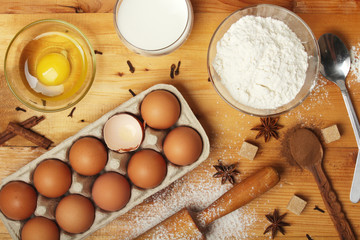 Food ingredients for baking: flour, eggs, milk, sugar	