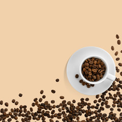 A white cup filled with freshly roasted coffee beans on a beige background. Coffee time. Flat lay, top view. Copy space