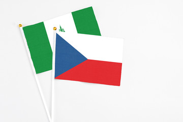 Czech Republic and Norfolk Island stick flags on white background. High quality fabric, miniature national flag. Peaceful global concept.White floor for copy space.