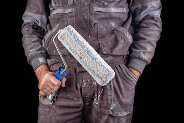 Painter holding paint rollers in his hand. Accessories for small home repairs.