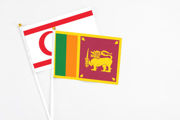 Sri Lanka and Northern Cyprus stick flags on white background. High quality fabric, miniature national flag. Peaceful global concept.White floor for copy space.