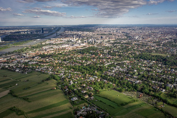 Aerial drone shot of vienna city with dramatic clouds in sunny day