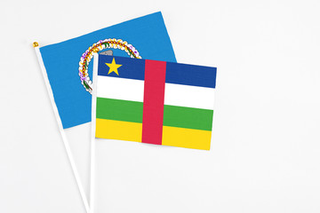 Central African Republic and Northern Mariana Islands stick flags on white background. High quality fabric, miniature national flag. Peaceful global concept.White floor for copy space.