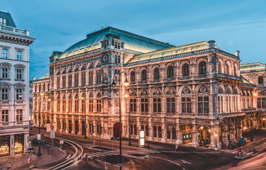 Fototapeta na wymiar Long exposure shot of Austiran National State Opera House Staatsoper with lights on in the eveing
