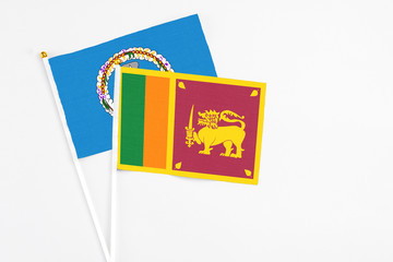 Sri Lanka and Northern Mariana Islands stick flags on white background. High quality fabric, miniature national flag. Peaceful global concept.White floor for copy space.