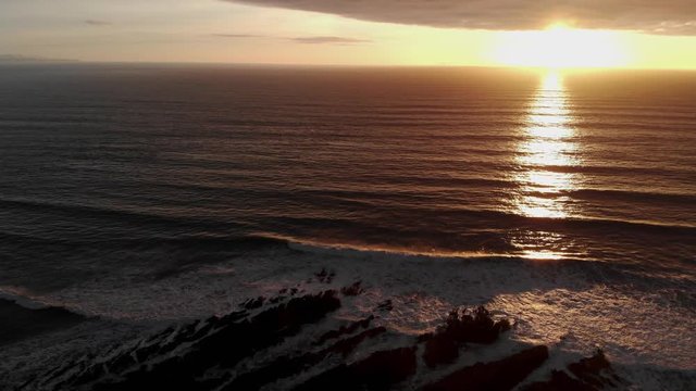 Aerial Sunset Over Rocks And Sea North Devon UK.