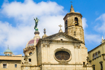 Fototapeta premium Barcelona, Gothic Quarter. Medieval Basilica De La Merce with statue of Our Lady with the infant Christ on dome., Spain
