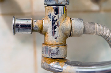 Bathroom mixer old dirty in plaque and rust, covered with condensate