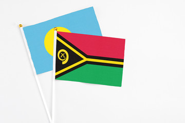 Vanuatu and Palau stick flags on white background. High quality fabric, miniature national flag....