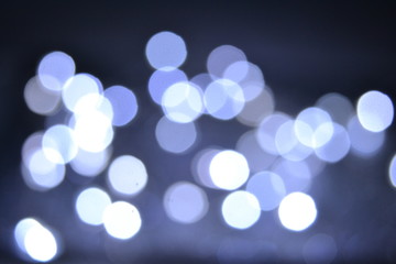 Lights on dark blue background. Christmas, New Year, night town landscape view concept defocus bokeh