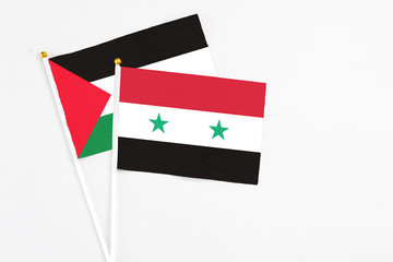 Syria and Palestine stick flags on white background. High quality fabric, miniature national flag....