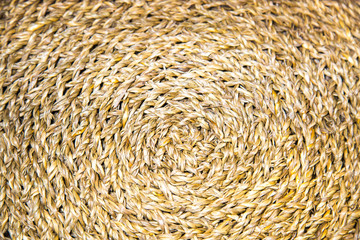 Napkin under appliances woven in a circle of seaweed yellow brown. Backgrounds, design, structures.