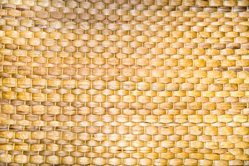 Napkin under appliances woven into a beautiful pattern of sea hyacinth yellow brown. Backgrounds, design, structures.