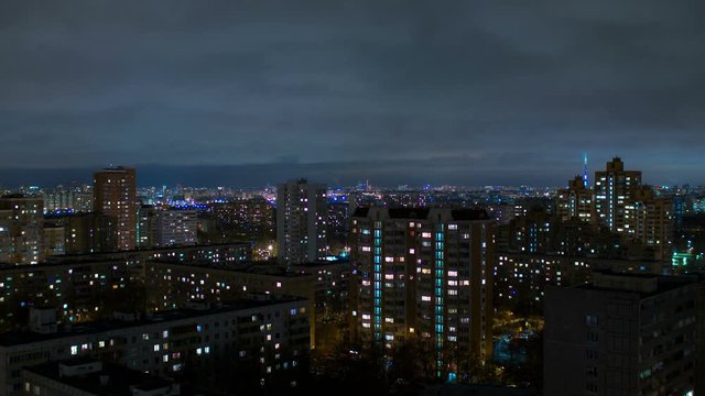 Moving cloudscape over the city at night, time lapse