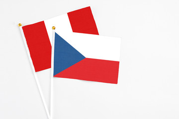 Czech Republic and Peru stick flags on white background. High quality fabric, miniature national flag. Peaceful global concept.White floor for copy space.