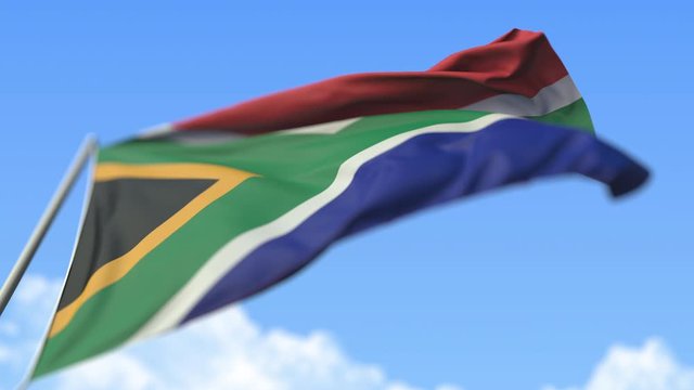 Flying flag of South Africa, low angle view. Loopable realistic slow motion 3D animation