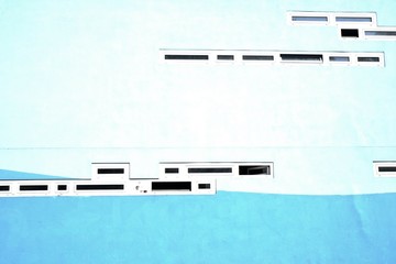 Contrasting dark windows on white wall