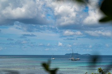 Beautiful view to catamaran boat in Seychelles bay, travel to a tropical island and boat tour...