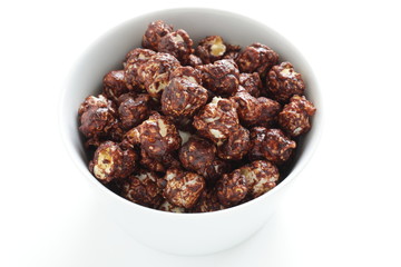 Chocolate popcorn in bowl with copy space