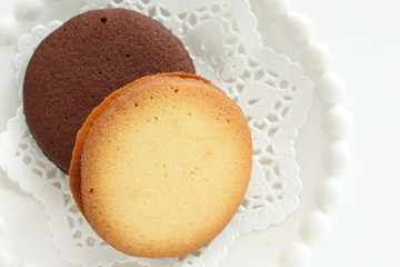 Vanilla and chocolate cookie on dish