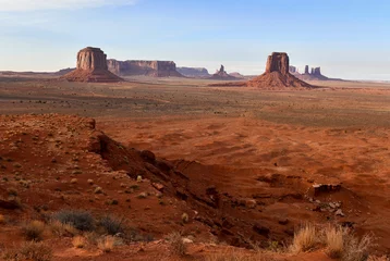 Wall murals Rood violet The Red rock desert landscape of Monument Valley, Navajo Tribal Park in the southwest USA in Arizona and Utah, America