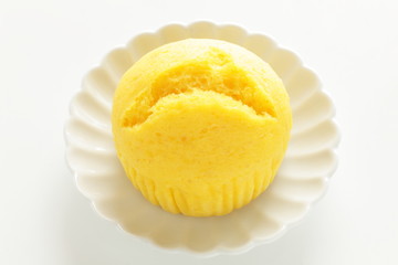 yellow steamed bun on dish for lemon cake image