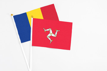 Isle Of Man and Romania stick flags on white background. High quality fabric, miniature national...