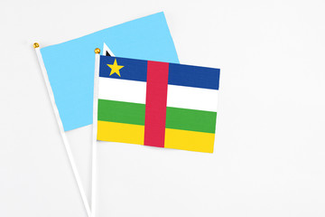 Central African Republic and Saint Lucia stick flags on white background. High quality fabric, miniature national flag. Peaceful global concept.White floor for copy space.