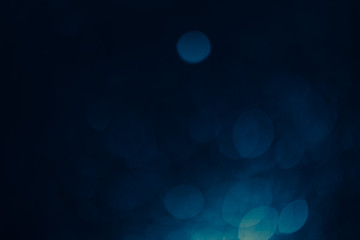 Dark blue Festive Christmas Beautiful abstract Background with bokeh lights. Holiday Texture with copy space. Can be used as Wallpaper, filling for a website, defocused