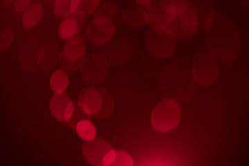 Red gold Festive Christmas Beautiful abstract Background with bokeh lights. Holiday Texture with copy space. Can be used as Wallpaper, filling for a website, defocused