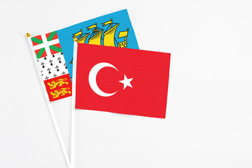 Turkey and Saint Pierre And Miquelon stick flags on white background. High quality fabric, miniature national flag. Peaceful global concept.White floor for copy space.