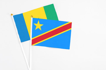 Congo and Saint Vincent And The Grenadines stick flags on white background. High quality fabric,...