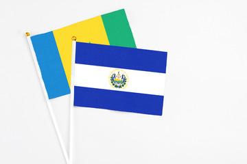 El Salvador and Saint Vincent And The Grenadines stick flags on white background. High quality...