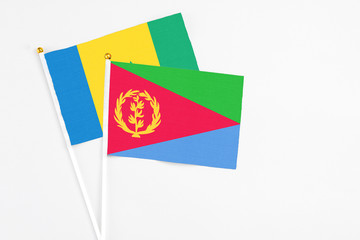 Eritrea and Saint Vincent And The Grenadines stick flags on white background. High quality fabric,...