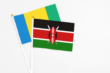 Kenya and Saint Vincent And The Grenadines stick flags on white background. High quality fabric,...