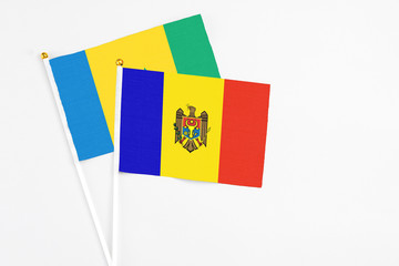 Moldova and Saint Vincent And The Grenadines stick flags on white background. High quality fabric,...