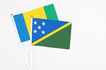 Solomon Islands and Saint Vincent And The Grenadines stick flags on white background. High quality...