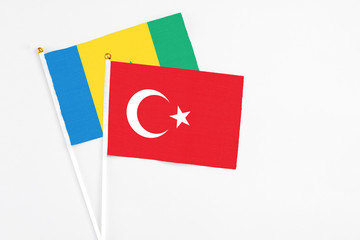 Turkey and Saint Vincent And The Grenadines stick flags on white background. High quality fabric, miniature national flag. Peaceful global concept.White floor for copy space.