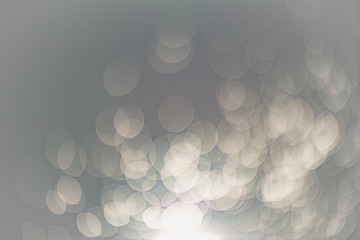 Light Festive Christmas Beautiful abstract Background with bokeh lights. Holiday Texture with copy space. Can be used as Wallpaper, filling for a website, defocused