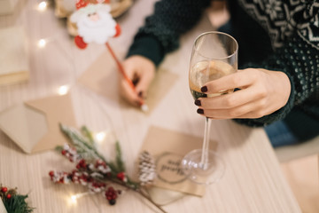 Woman's hand holding a glass of champagne