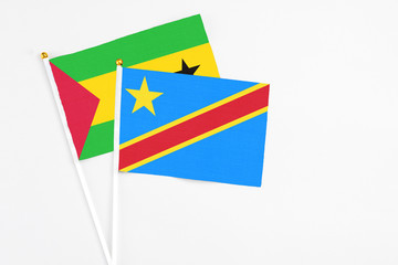 Congo and Sao Tome And Principe stick flags on white background. High quality fabric, miniature national flag. Peaceful global concept.White floor for copy space.
