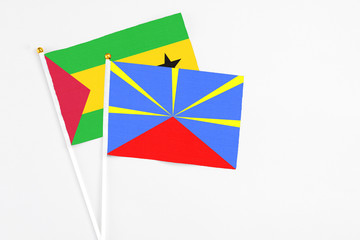 Reunion and Sao Tome And Principe stick flags on white background. High quality fabric, miniature...