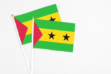 Sao Tome And Principe and Sao Tome And Principe stick flags on white background. High quality fabric, miniature national flag. Peaceful global concept.White floor for copy space.
