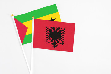 Albania and Saudi Arabia stick flags on white background. High quality fabric, miniature national flag. Peaceful global concept.White floor for copy space.