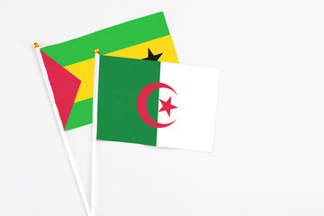 Algeria and Saudi Arabia stick flags on white background. High quality fabric, miniature national...