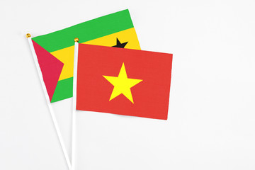 Vietnam and Saudi Arabia stick flags on white background. High quality fabric, miniature national flag. Peaceful global concept.White floor for copy space.