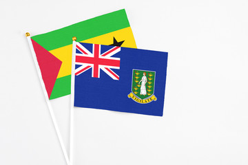 Fototapeta premium British Virgin Islands and Saudi Arabia stick flags on white background. High quality fabric, miniature national flag. Peaceful global concept.White floor for copy space.