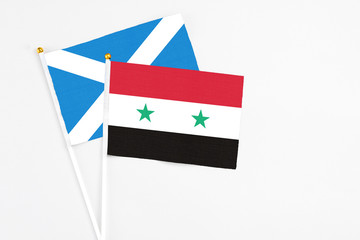 Syria and Scotland stick flags on white background. High quality fabric, miniature national flag....